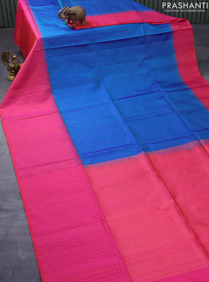 Pure soft silk saree dual shade of blue and dual shade of pinkish orange with allover zari woven buttas and zari checked border