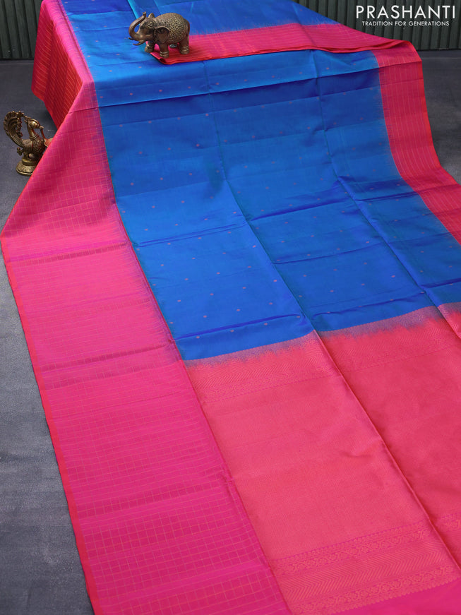 Pure soft silk saree dual shade of blue and dual shade of pinkish orange with allover zari woven buttas and zari checked border