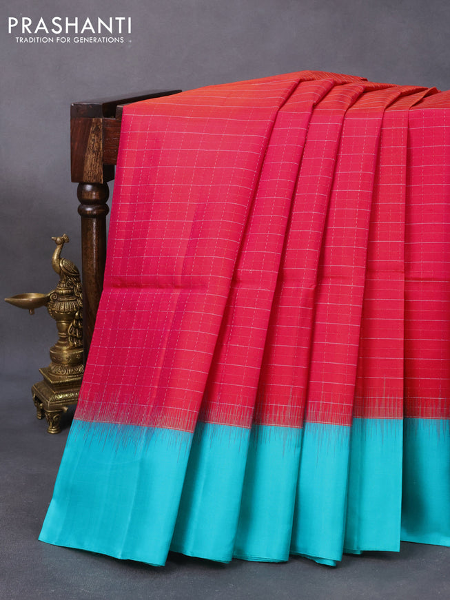 Pure soft silk saree dual shade of pinkish orange and teal blue with allover silver zari checks and simple border