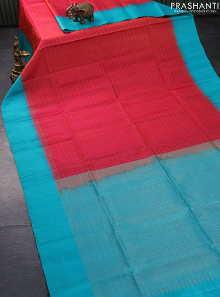 Pure soft silk saree dual shade of pinkish orange and teal blue with allover silver zari checks and simple border