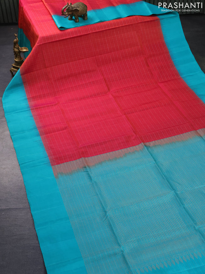 Pure soft silk saree dual shade of pinkish orange and teal blue with allover silver zari checks and simple border