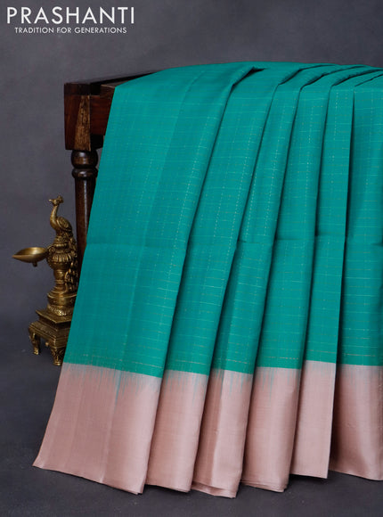 Pure soft silk saree teal blue and peach shade with allover zari checked pattern and simple border