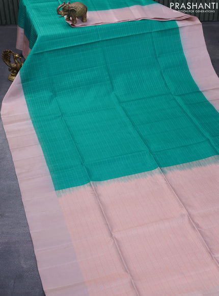 Pure soft silk saree teal blue and peach shade with allover zari checked pattern and simple border