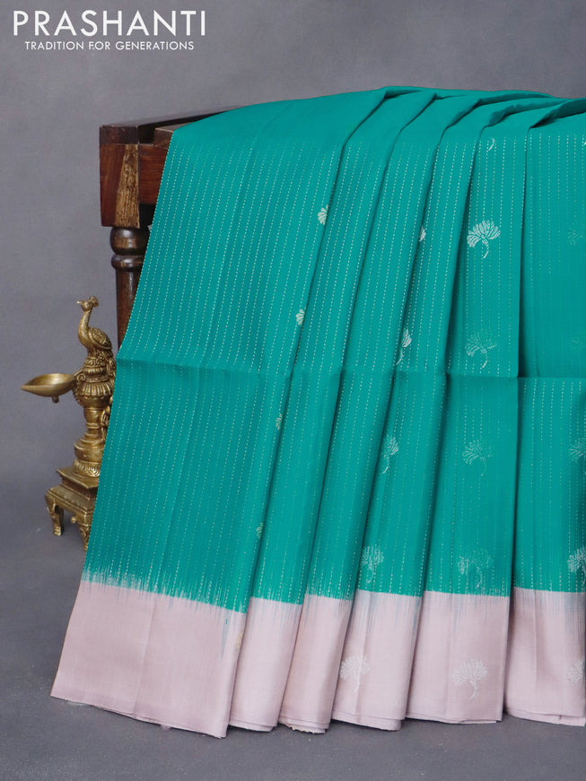 Pure soft silk saree teal green and mild purple with allover silver zari weaves and zari woven butta border