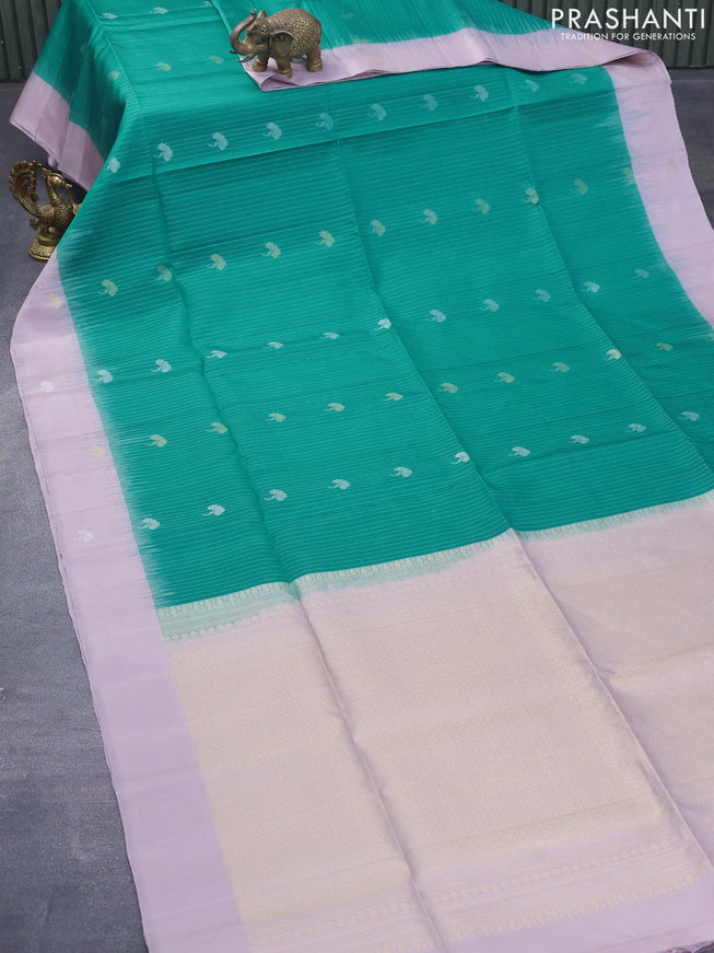 Pure soft silk saree teal green and mild purple with allover silver zari weaves and zari woven butta border