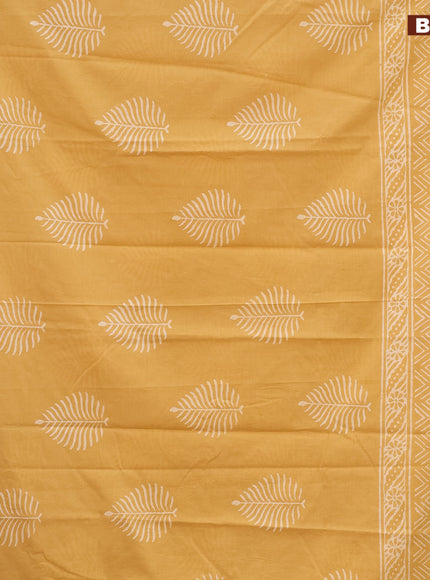 Jaipur cotton saree mustard shade with leaf butta prints and printed border