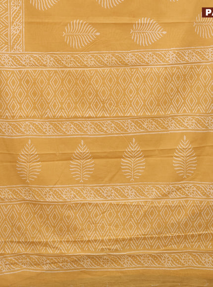 Jaipur cotton saree mustard shade with leaf butta prints and printed border