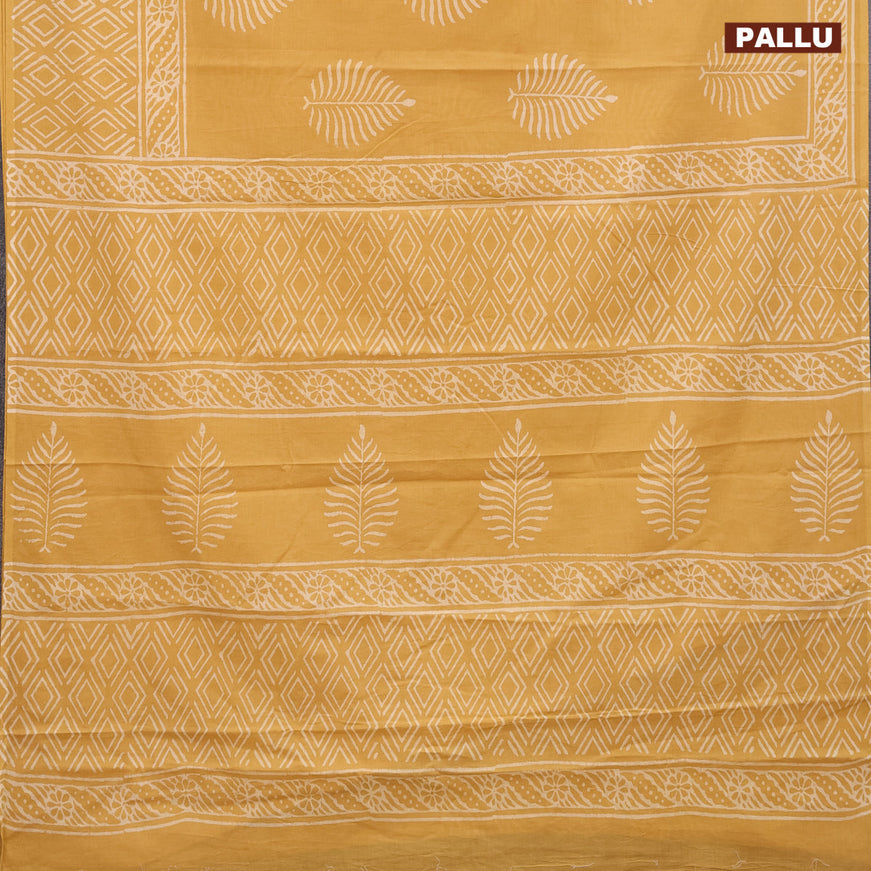 Jaipur cotton saree mustard shade with leaf butta prints and printed border