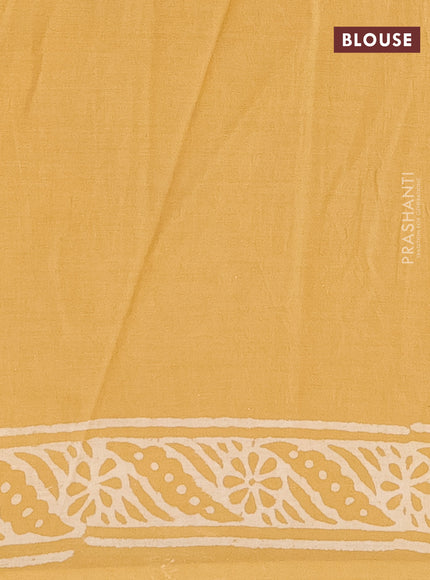 Jaipur cotton saree mustard shade with leaf butta prints and printed border