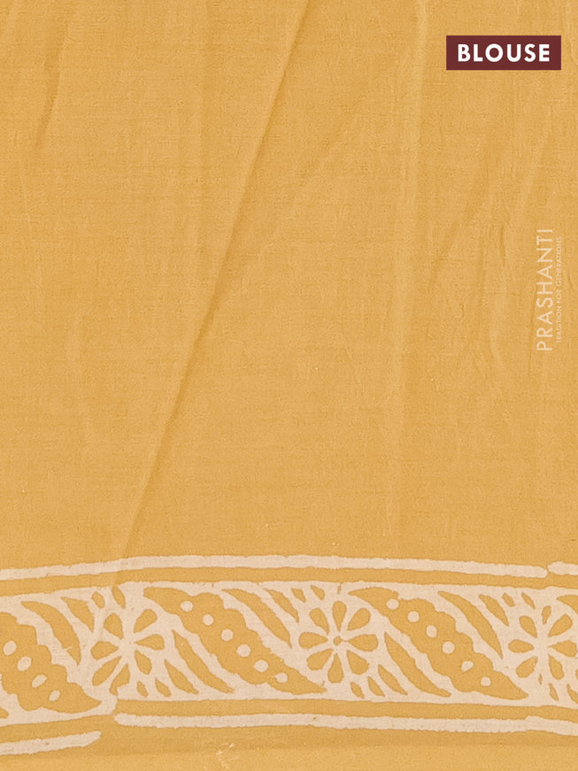 Jaipur cotton saree mustard shade with leaf butta prints and printed border