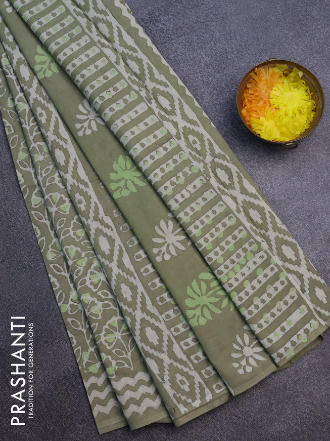 Jaipur cotton saree pastel green shade with allover prints and printed border