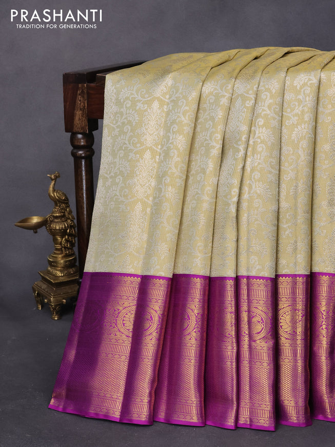 Pure kanjivaram tissue silk saree cream and purple with allover silver zari woven brocade weaves and long rich annam zari woven border