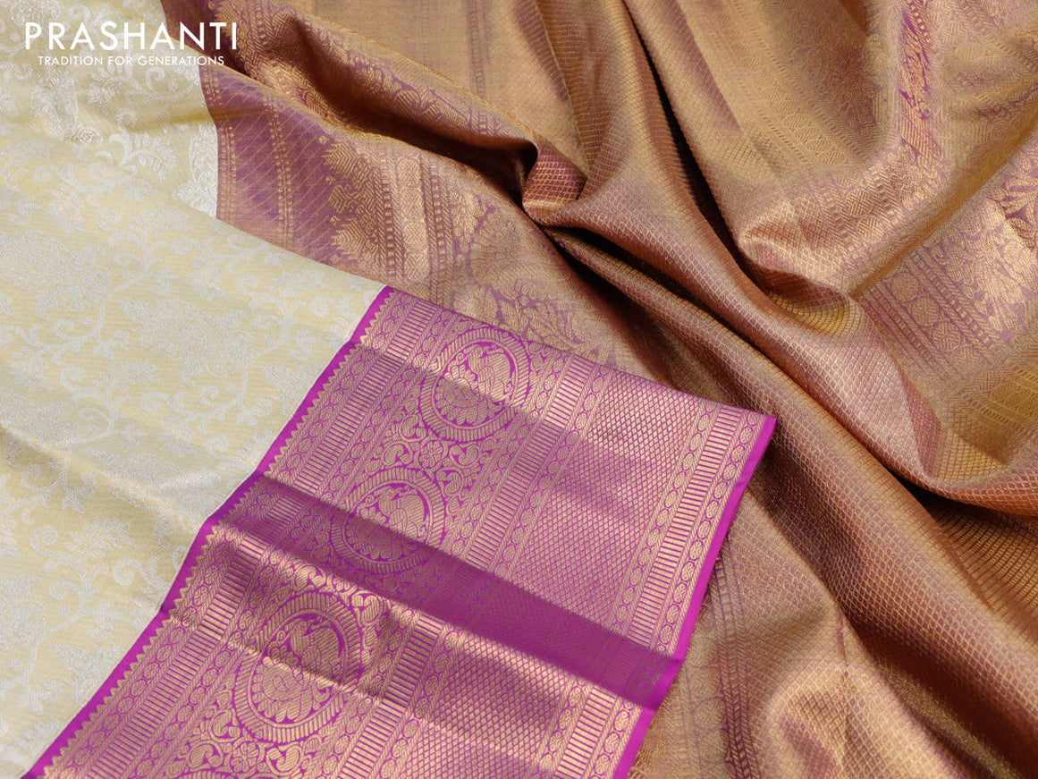 Pure kanjivaram tissue silk saree cream and purple with allover silver zari woven brocade weaves and long rich annam zari woven border