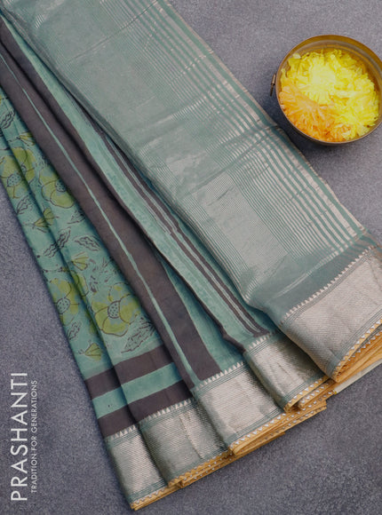 Chanderi silk cotton saree pastel green shade and mustard yellow with natural vegetable prints and zari woven gotapatti lace border