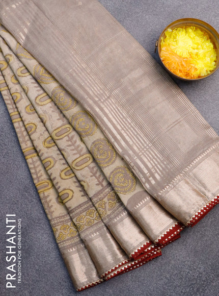 Chanderi silk cotton saree beige and maroon with natural vegetable prints and zari woven gotapatti lace border