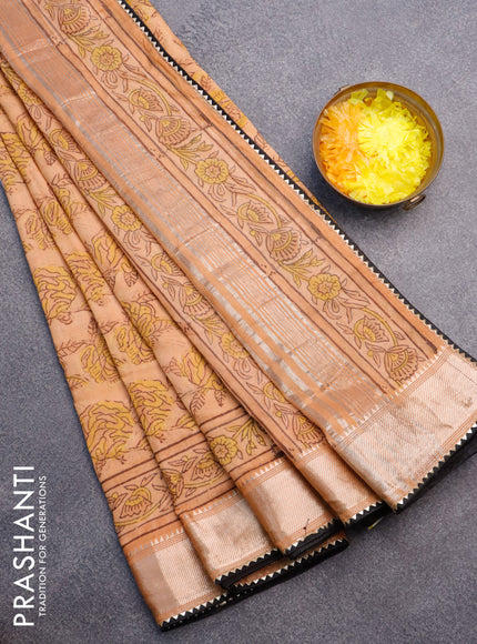 Chanderi silk cotton saree pale orange and black with natural vegetable prints and zari woven gotapatti lace border