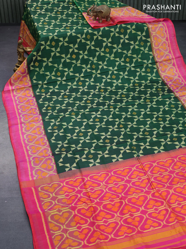 Rajkot patola silk saree green and dual shade of pinkish orange with allover ikat weaves & zari buttas and ikat woven zari border