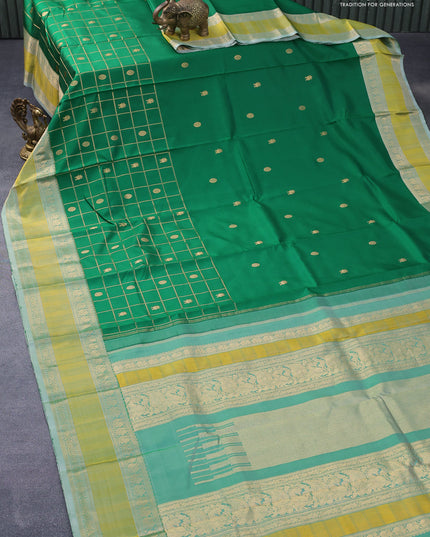 Pure kanjivaram silk saree green and green shade with zari woven buttas and rettapet zari woven border