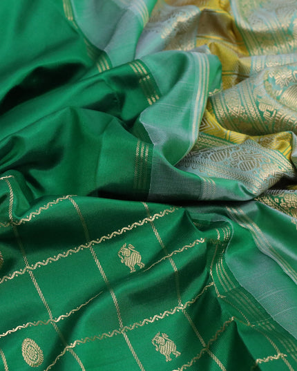 Pure kanjivaram silk saree green and green shade with zari woven buttas and rettapet zari woven border