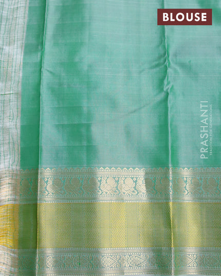 Pure kanjivaram silk saree green and green shade with zari woven buttas and rettapet zari woven border