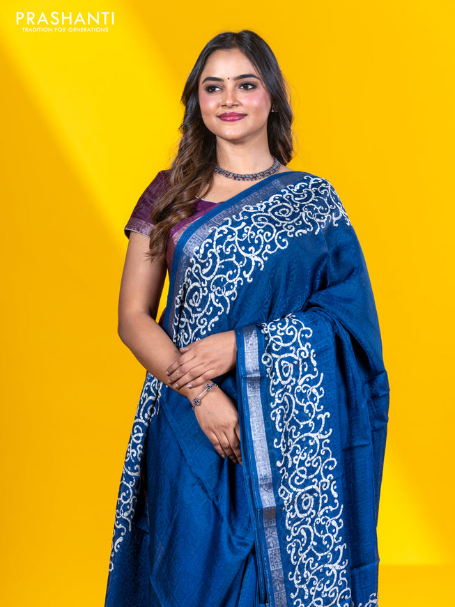 Semi crepe saree peacock blue with allover self emboss and batik printed border