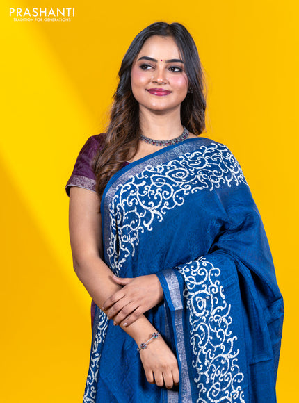 Semi crepe saree peacock blue with allover self emboss and batik printed border