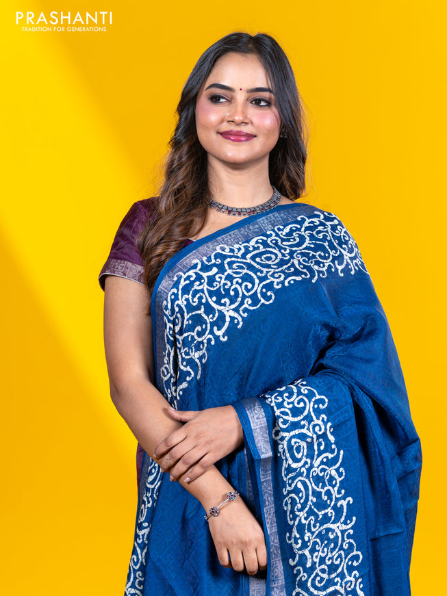 Semi crepe saree peacock blue with allover self emboss and batik printed border