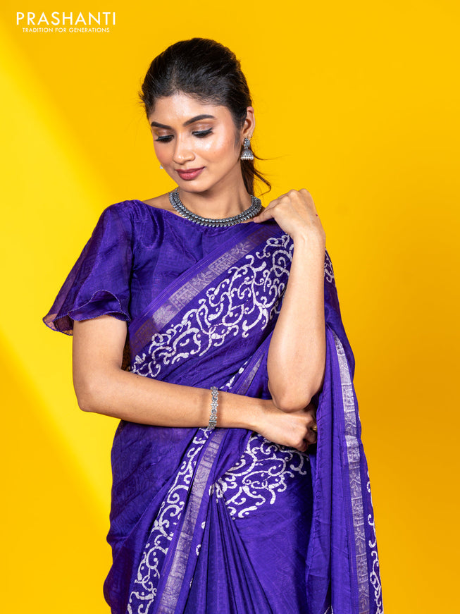 Semi crepe saree violet with allover self emboss and batik printed border