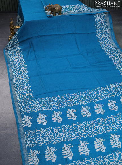 Semi crepe saree teal blue with allover self emboss and batik printed border