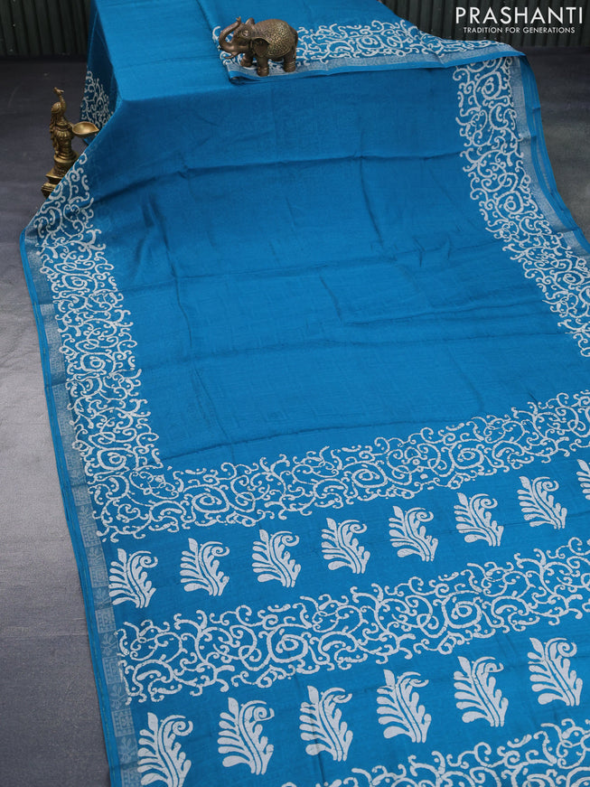 Semi crepe saree teal blue with allover self emboss and batik printed border