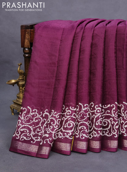 Semi crepe saree wine shade with allover self emboss and batik printed border