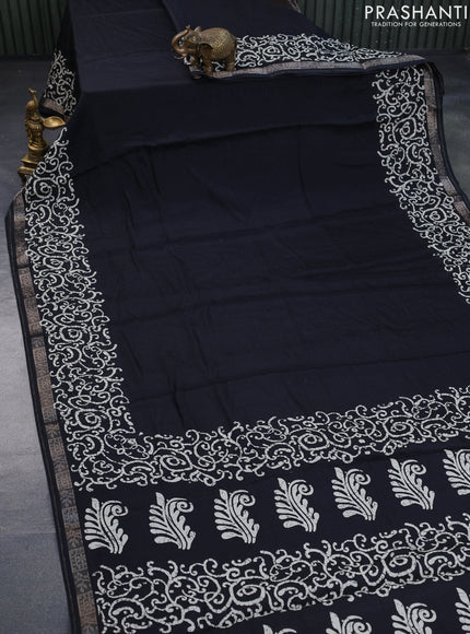 Semi crepe saree black with allover self emboss and batik printed border