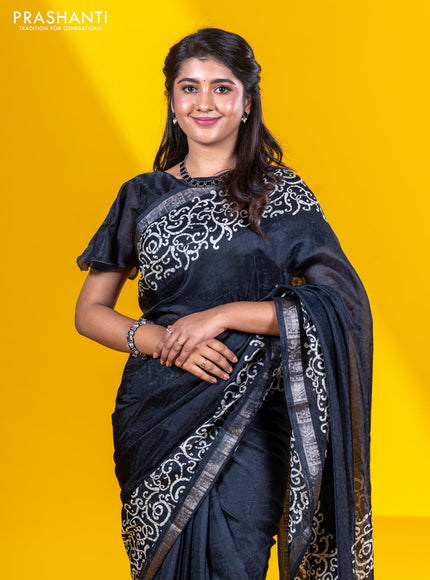 Semi crepe saree black with allover self emboss and batik printed border