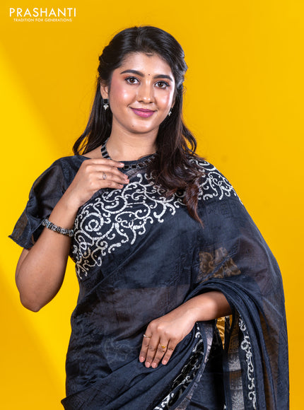 Semi crepe saree black with allover self emboss and batik printed border