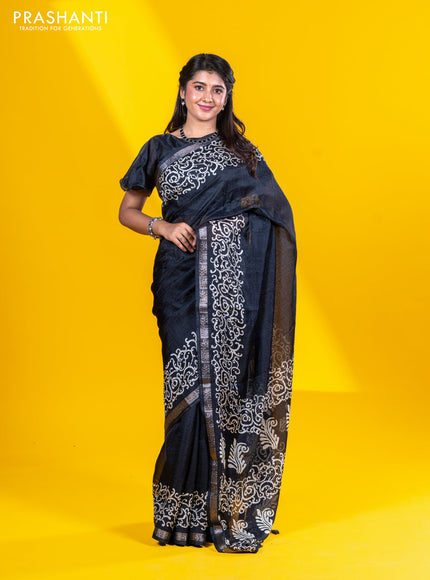 Semi crepe saree black with allover self emboss and batik printed border