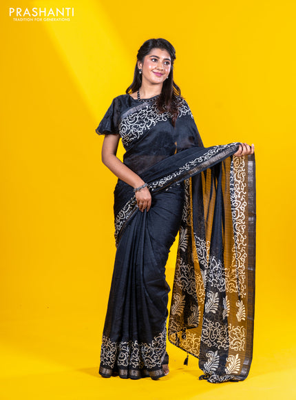 Semi crepe saree black with allover self emboss and batik printed border