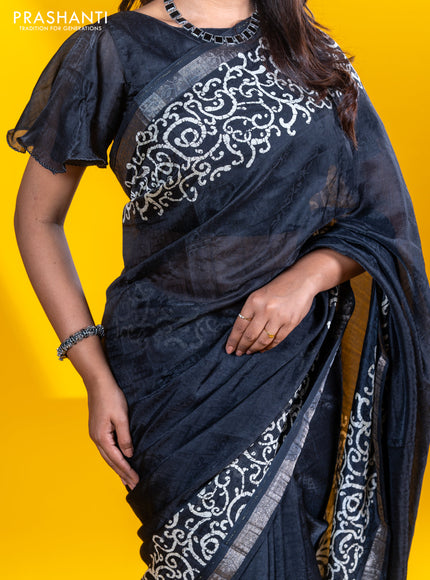 Semi crepe saree black with allover self emboss and batik printed border