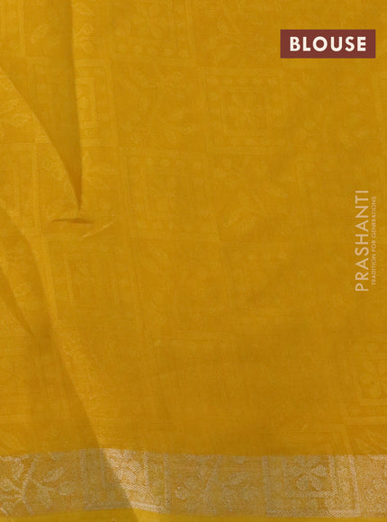 Semi crepe saree yellow with allover self emboss and batik printed border