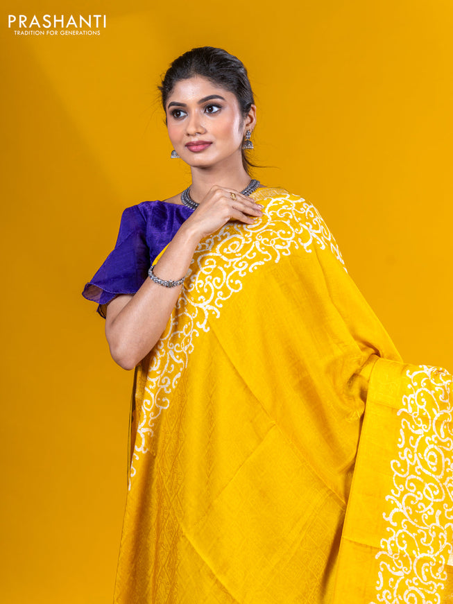 Semi crepe saree yellow with allover self emboss and batik printed border