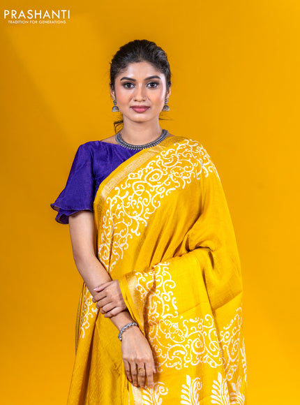 Semi crepe saree yellow with allover self emboss and batik printed border