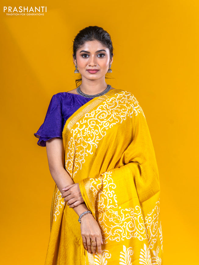 Semi crepe saree yellow with allover self emboss and batik printed border