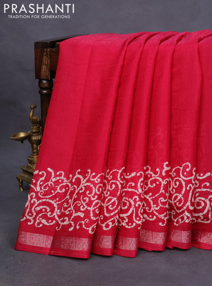 Semi crepe saree tomato pink with allover self emboss and batik printed border