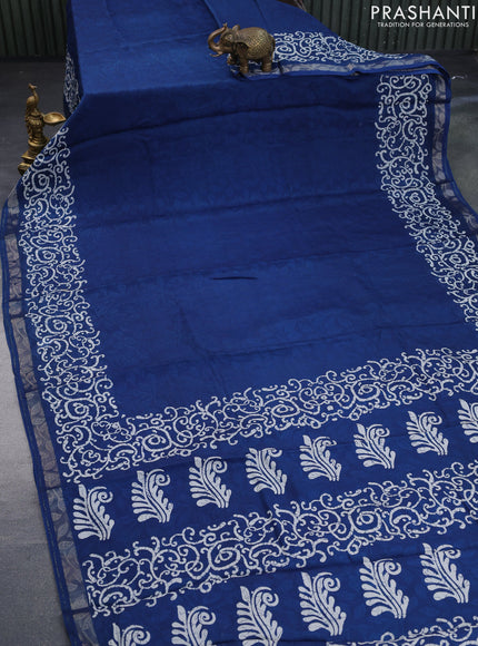 Semi crepe saree peacock blue with allover self emboss and batik printed border