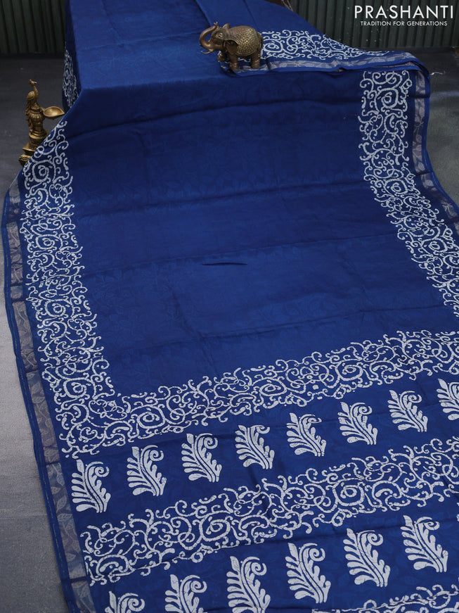 Semi crepe saree peacock blue with allover self emboss and batik printed border