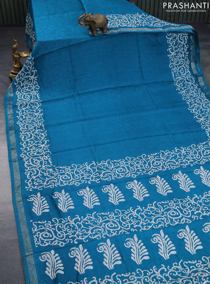 Semi crepe saree teal blue with allover self emboss and batik printed border