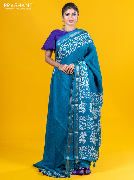 Semi crepe saree teal blue with allover self emboss and batik printed border