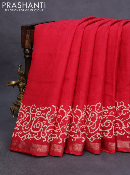 Semi crepe saree red with allover self emboss and batik printed border