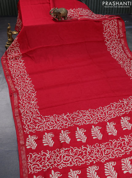 Semi crepe saree red with allover self emboss and batik printed border