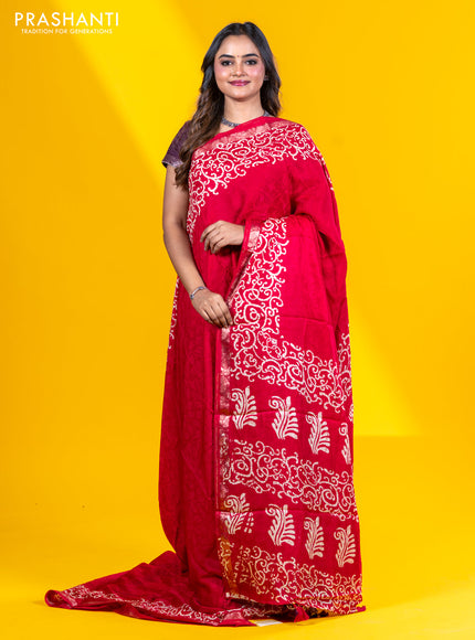 Semi crepe saree red with allover self emboss and batik printed border