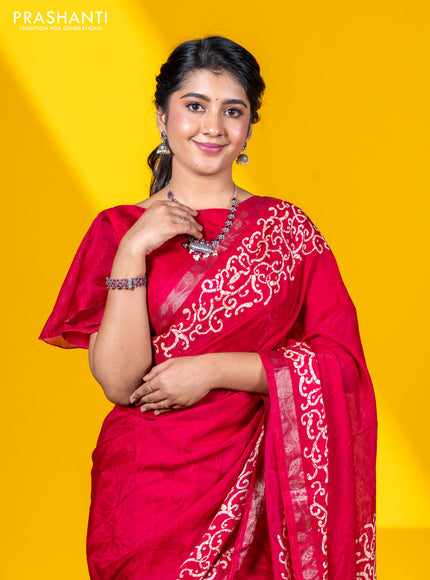 Semi crepe saree tomato pink with allover self emboss and batik printed border